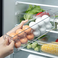 Clear refrigerator storage container with mixed eggs, promoting organization and eco-friendly design.