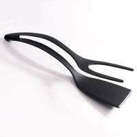 Multifunctional egg flipping shovel with food clip for effortless cooking and food handling.