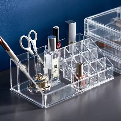 Transparent acrylic makeup organizer displaying cosmetics, lipsticks, and beauty tools for a tidy vanity.