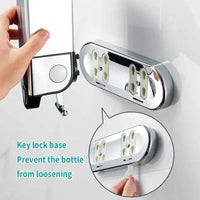 Close-up of wall mounted soap dispenser with key lock base for secure bottle holding and easy access.