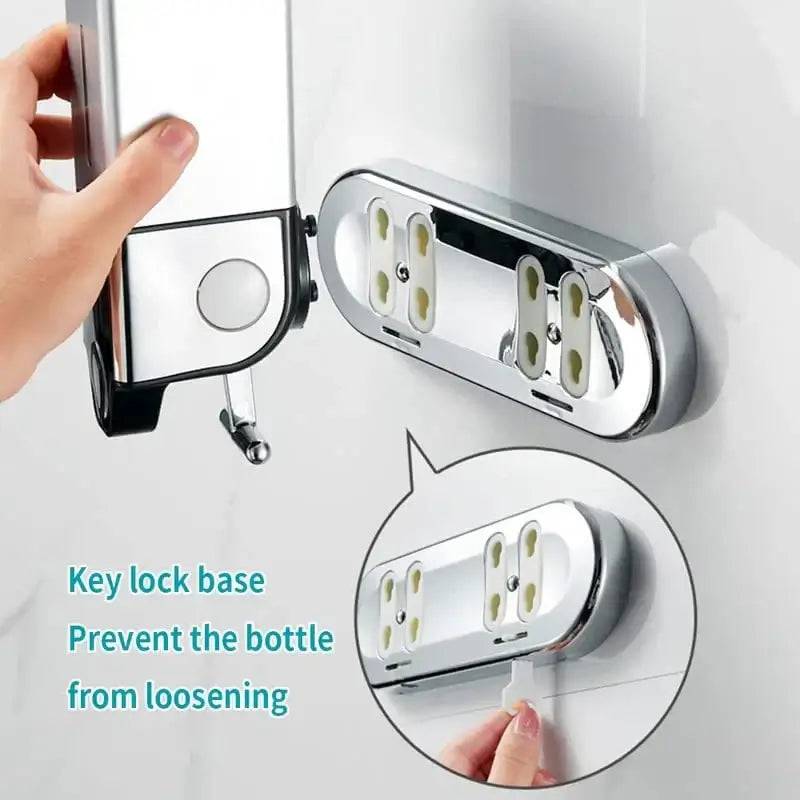 Close-up of wall mounted soap dispenser with key lock base for secure bottle holding and easy access.