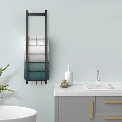Modern wall-mounted towel rack in black finish displaying neatly stacked towels in a contemporary bathroom setting.