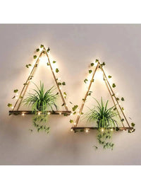Artificial Ivy LED Illuminated Wall Shelf featuring geometric design with plants and warm lights for a cozy atmosphere.
