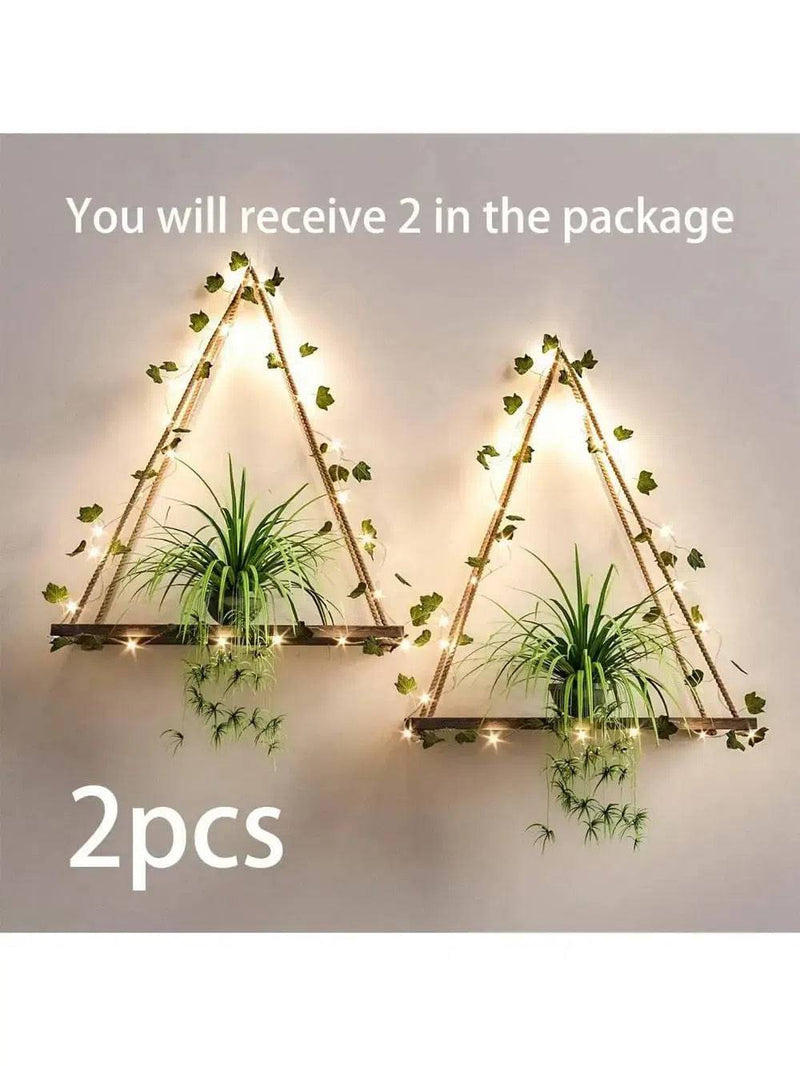 Set of 2 triangle-shaped artificial ivy LED illuminated wall shelves with plants for home decor.