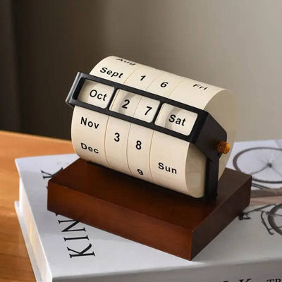 Large rotating desk calendar showing date, month, and day with elegant design, perfect for any workspace organization.