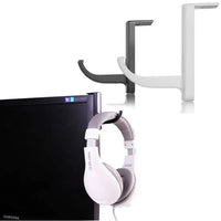 Universal headphone holder in black and white attached to a monitor with a white headphone hanging underneath.