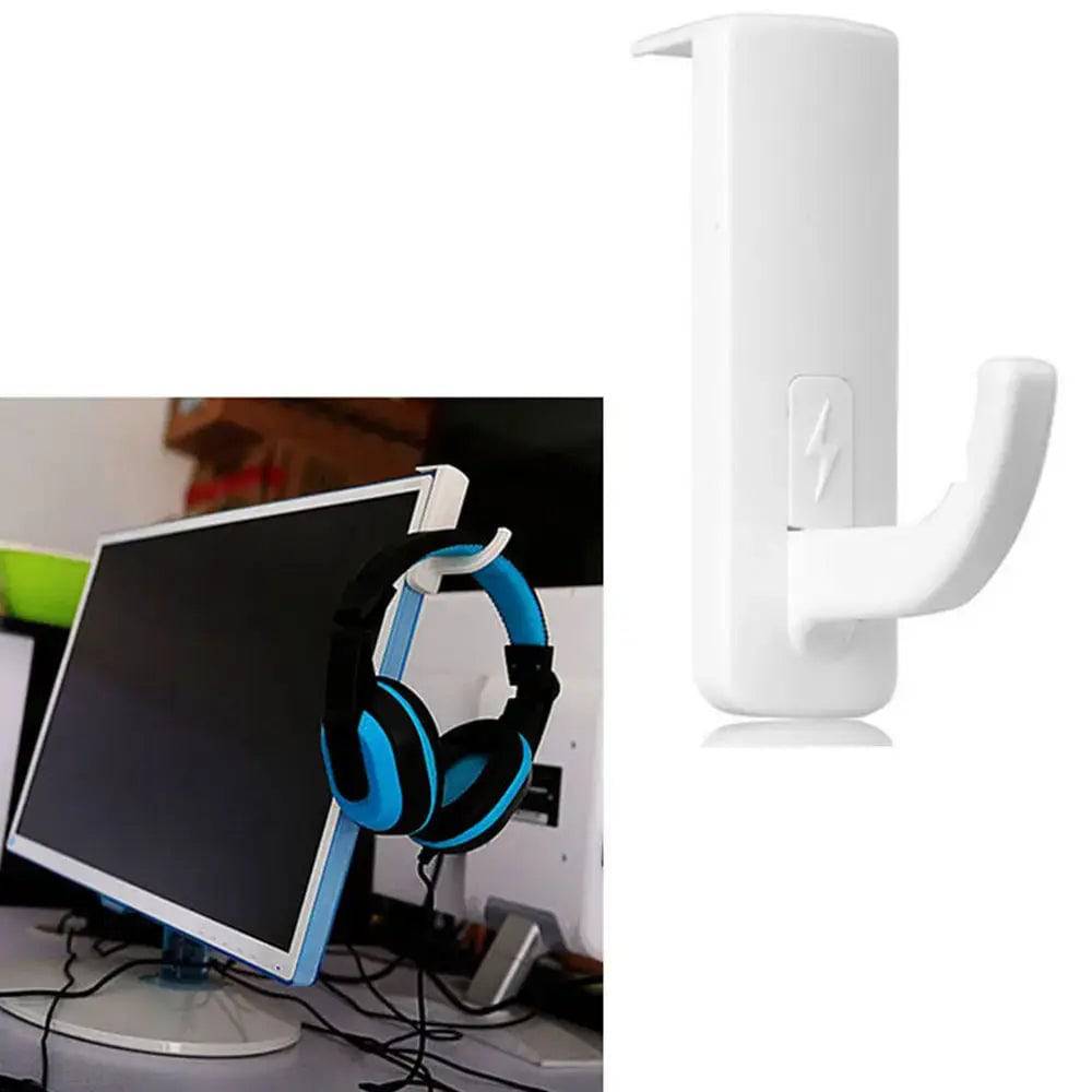Universal headphone holder in white, securely attached to a monitor with headphones hanging for organization and style.