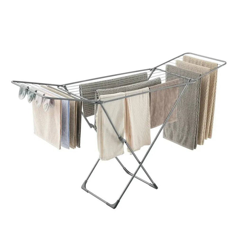 Foldable clothes drying rack with gullwing arms showcasing towels and clothes, perfect for space-saving laundry solutions.