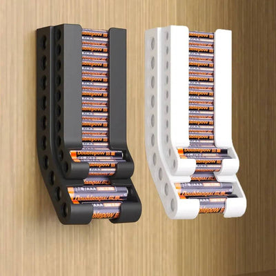 Wall-mounted battery holder in black and white, organized for easy access and space-saving storage.