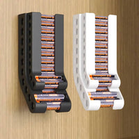 Wall-mounted battery holder in black and white, organized for easy access and space-saving storage.