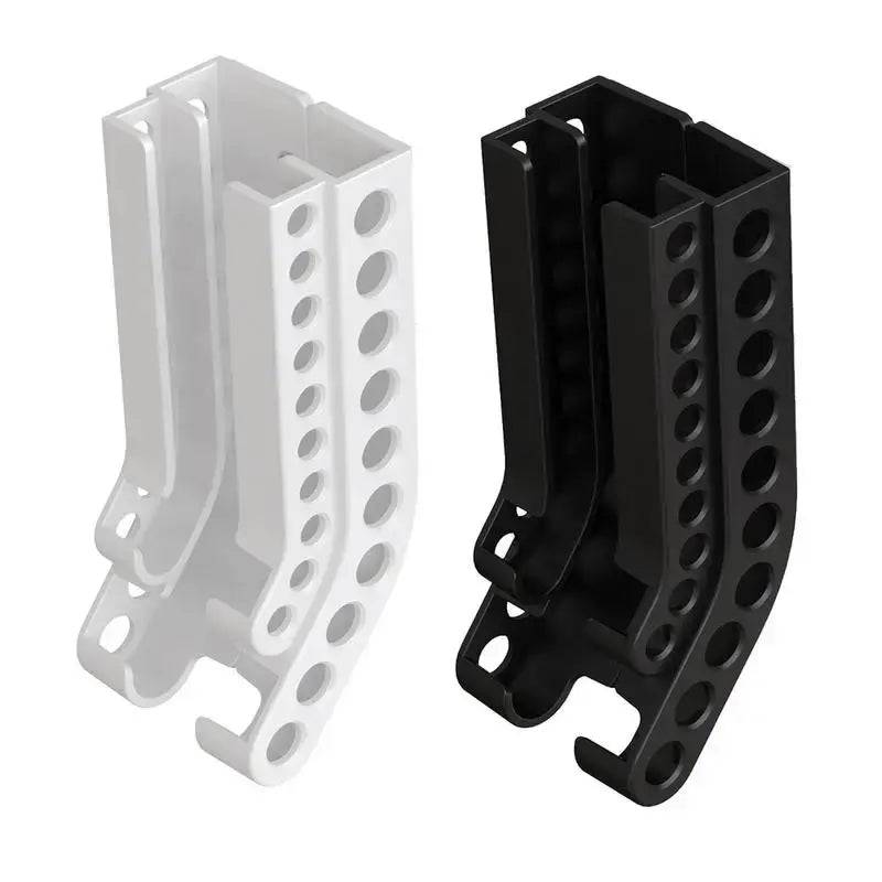 Wall-mounted battery holder compact organiser in white and black colors, ideal for tidy battery storage.