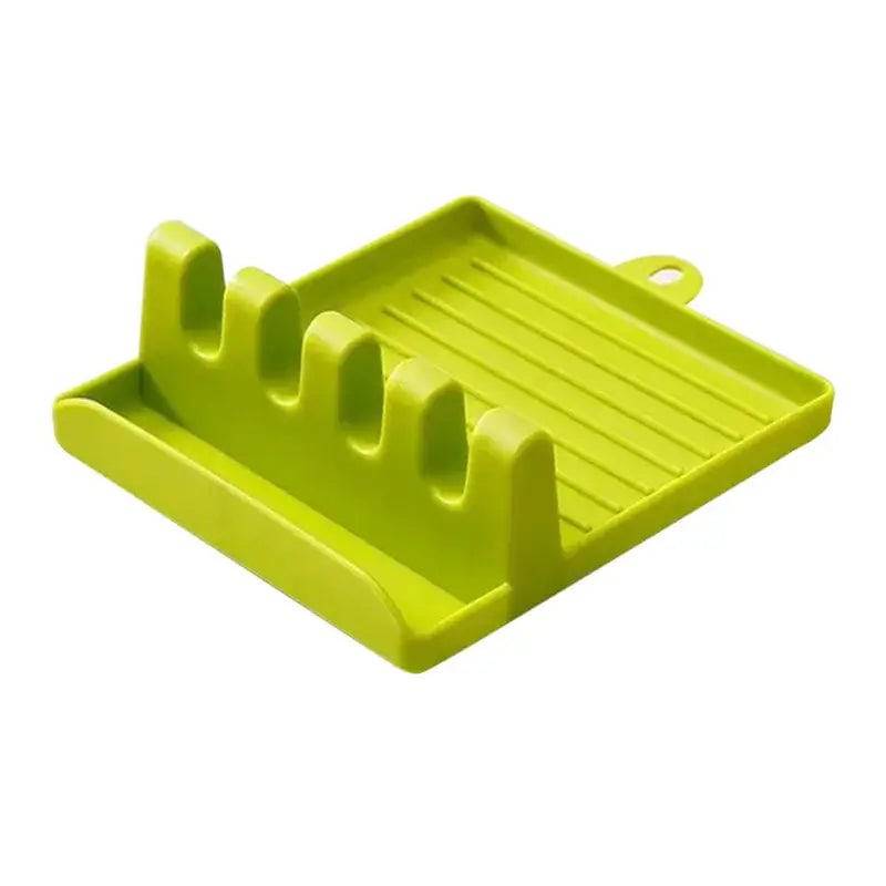 Bright green plastic utensil holder with non-slip design, featuring slots for organizing kitchen tools neatly.