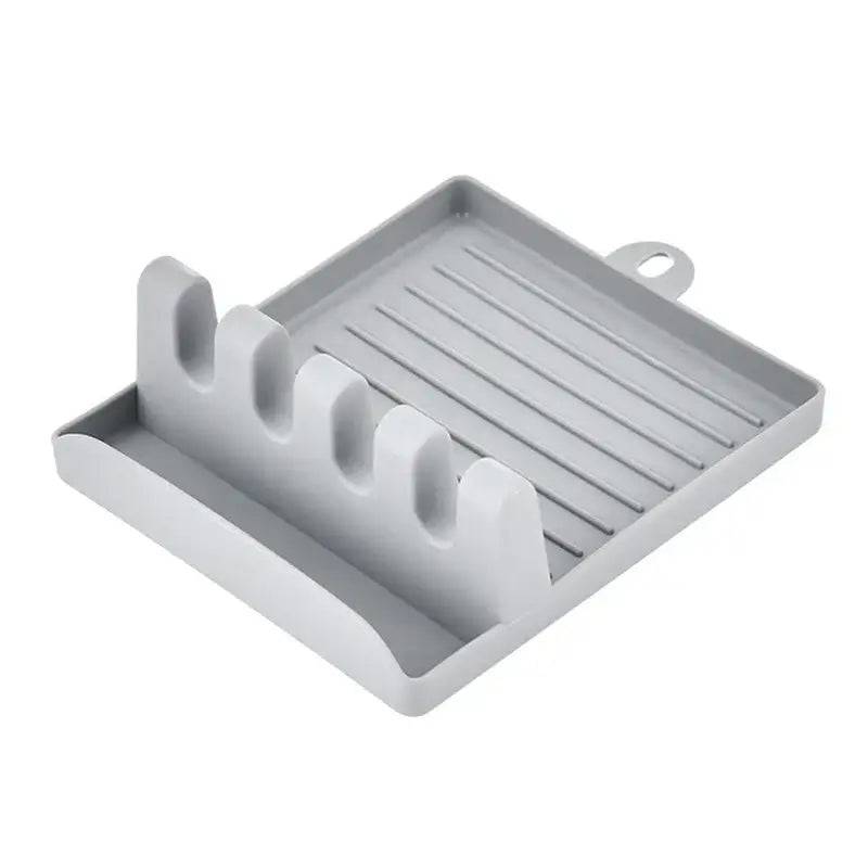 Gray plastic utensil holder with non-slip design for organized kitchen tools and utensils.