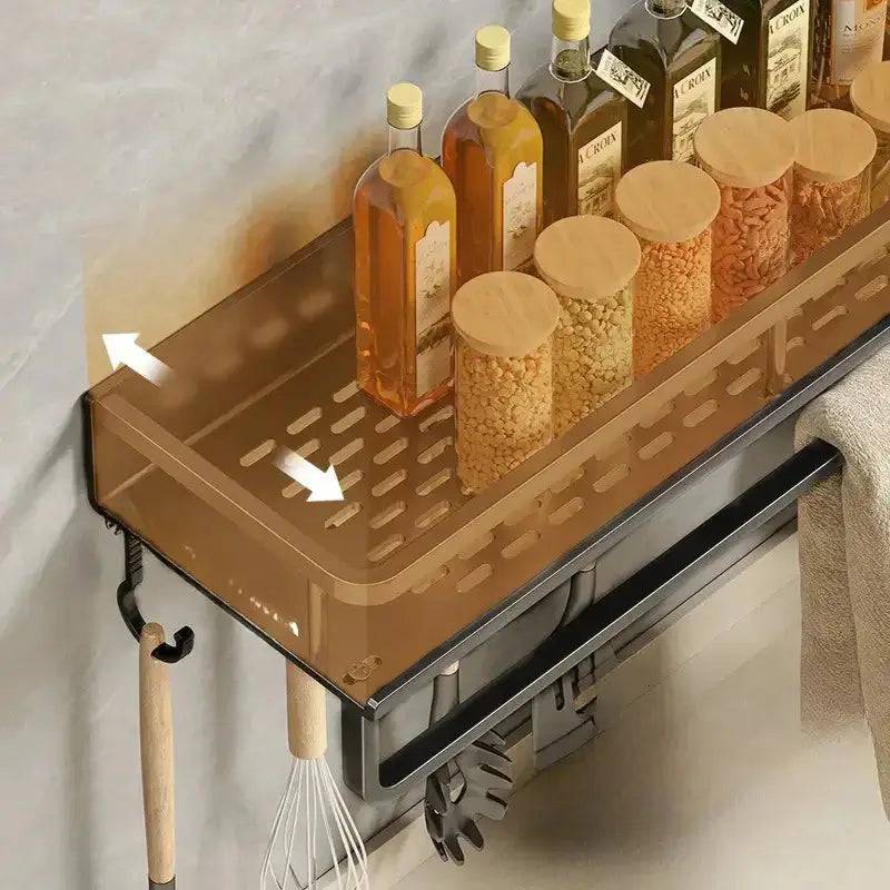 Sleek wall-mounted spice rack with bottles and containers, featuring a towel bar for organized kitchen storage.