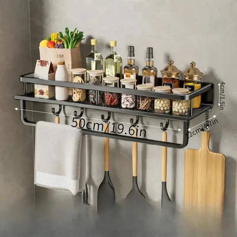 Wall-mounted spice rack with towel bar showcasing organized spices, oils, and utensils for kitchen convenience.