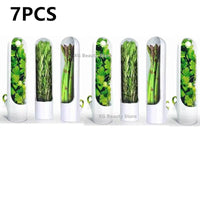 Seven Herb Saver Containers showcasing fresh herbs and vegetables, designed to extend freshness and flavor in the kitchen.