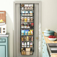Multi-tier overdoor storage basket made of carbon steel, organized with jars and boxes, maximizing kitchen space.