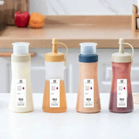 Multi-Purpose Condiment Dispenser set with various sauces, ideal for organizing spices and condiments in the kitchen.