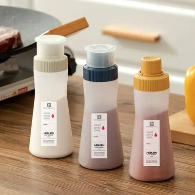 Set of three stylish multi-purpose condiment dispensers for spices and sauces in a kitchen setting.