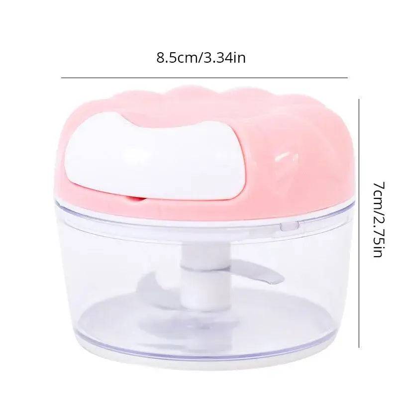 Manual garlic masher with stainless steel blades and pink design, perfect for easy garlic mincing and meal prep.
