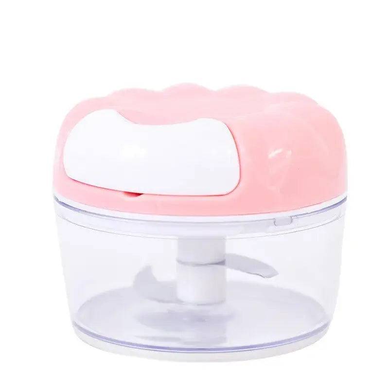 Manual garlic masher with stainless steel blades and pink lid, perfect for effortless garlic prep in the kitchen.