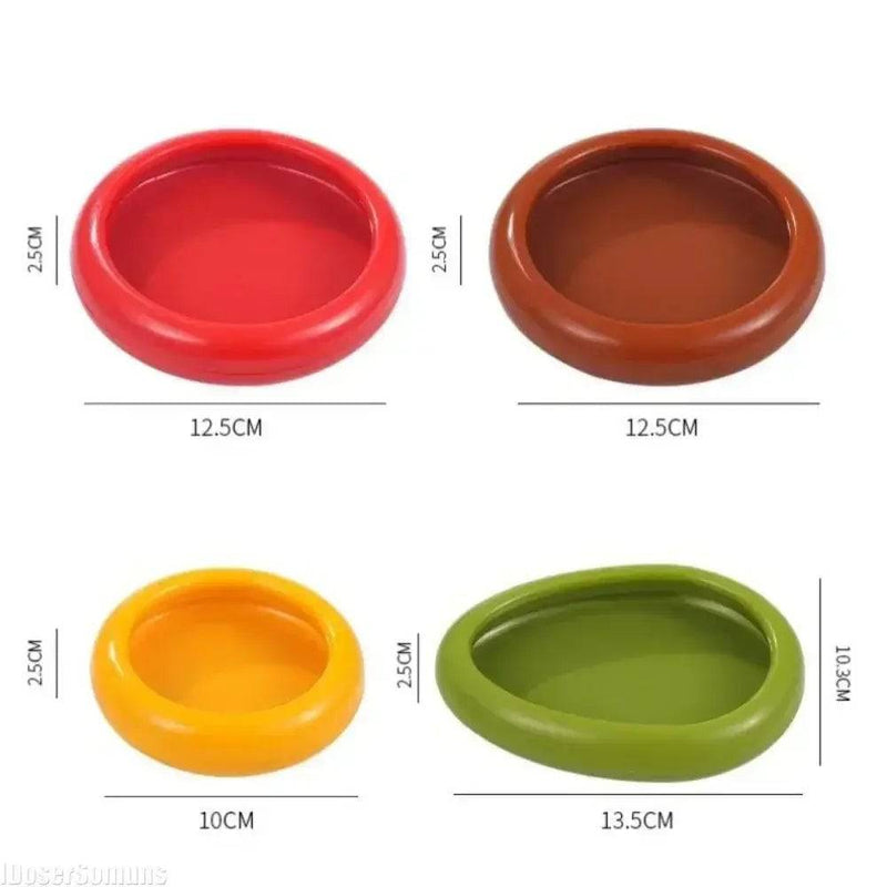 Colorful silicone food storage containers in red, brown, yellow, and green, perfect for keeping produce fresh.