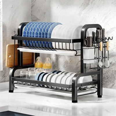 Compact 2-tier dish drying rack with plates, utensils, and glasses for efficient kitchen organization.