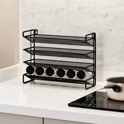 Metal spice rack in classic black finish with four tiers, perfect for organizing spices and enhancing kitchen decor.