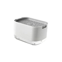 Stylish white soap dispenser with integrated sponge holder for organized kitchen sink.
