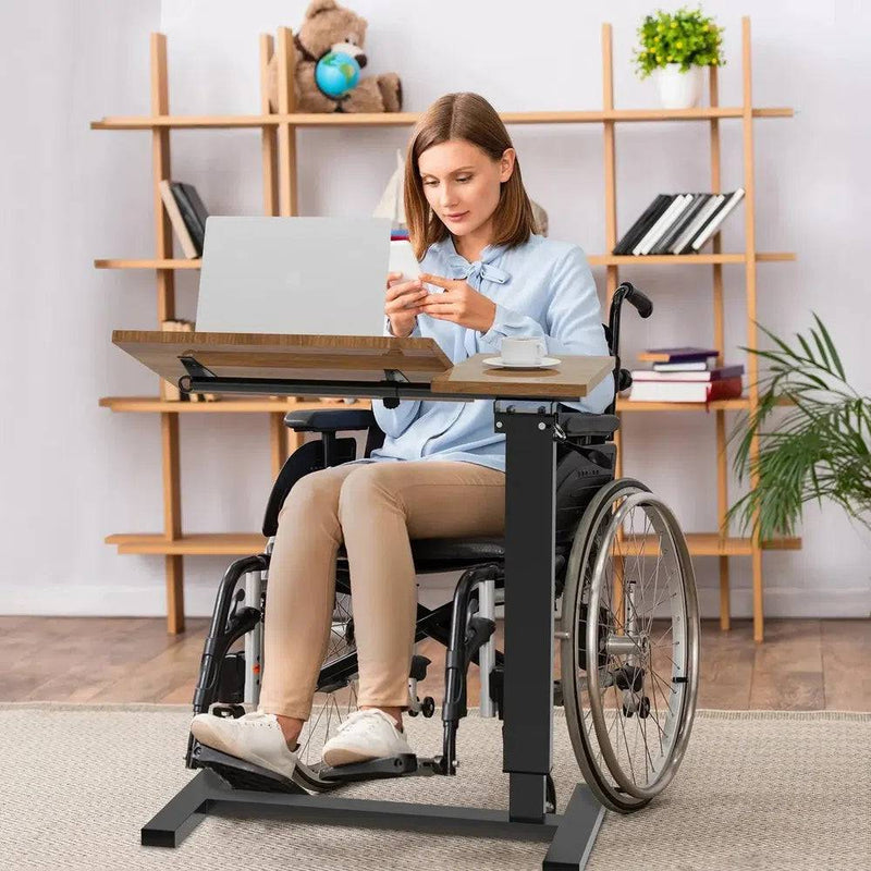 Woman using an adjustable overbed table with rolling wheels while sitting in a wheelchair, perfect for work or leisure.