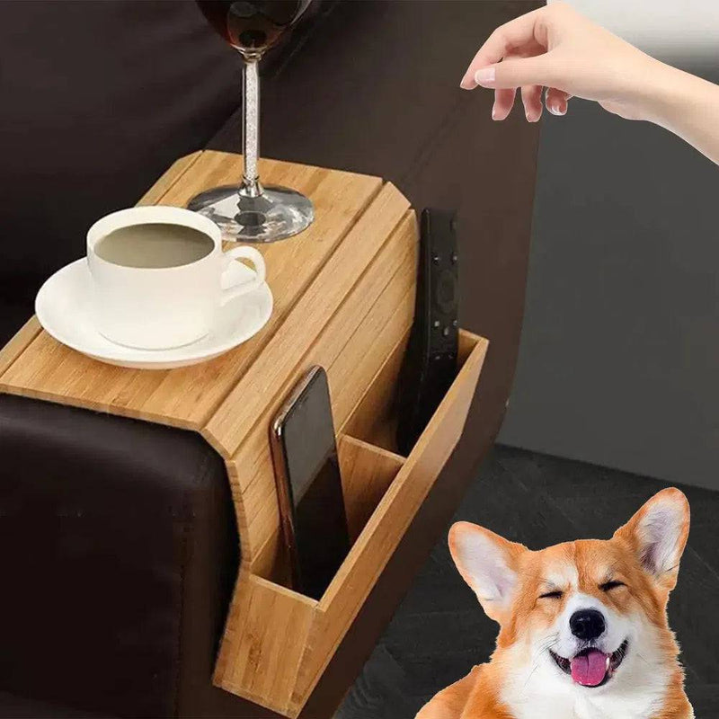 Wooden sofa armrest organizer holding a cup, phone, and remote control for convenient living room organization.