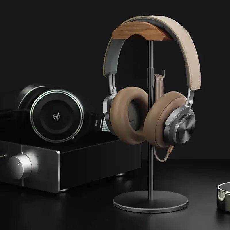 Stylish walnut headphone stand with aluminum base for elegant desk organization and gaming setup.