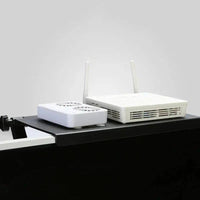 Adjustable monitor top storage rack with two wireless routers for organized workspace.