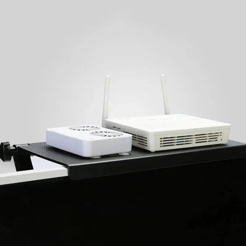 Adjustable monitor top storage rack with two wireless routers for organized workspace.