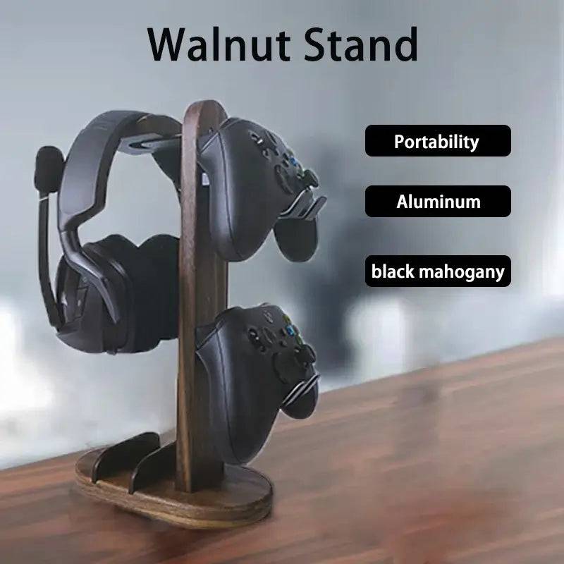 Walnut wood headphone stand with aluminum frame displaying headphones and controllers, highlighting its stylish design.