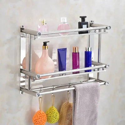Wall mounted bathroom shelf with towel bars holding various beauty products and towels, adding style and functionality.