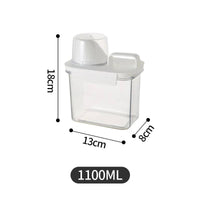 Clear refillable laundry detergent dispenser with 1100ML capacity and compact dimensions for efficient storage and accessibility.