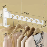 Adjustable angle clothes drying rack wall-mounted with hooks for efficient laundry drying space.