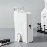 Eco-friendly reusable laundry detergent bottle with clear top, promoting sustainable living in modern washrooms.